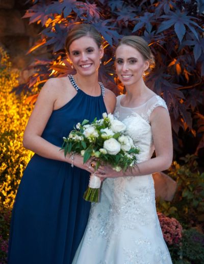 Bride Lindsay and her maid of honor wearing handcrafted pearl bridal jewelry from Carrie Whelan Designs