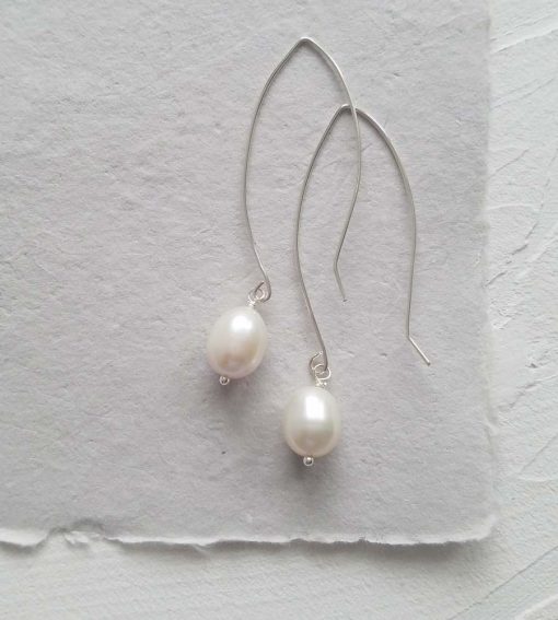 Long dangle pearl earrings for a bride handmade by Carrie Whelan Designs