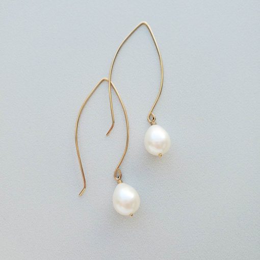 Long drop pearl earrings in gold by Carrie Whelan Designs