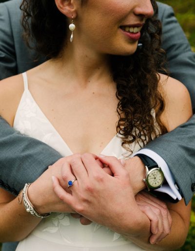 Bride Liza wearing freshwater coin pearl bridal earrings handcrafted by Carrie Whelan Designs