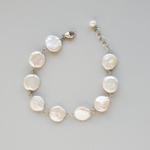 Wire wrapped coin pearl bracelet in sterling silver handmade by Carrie Whelan Designs