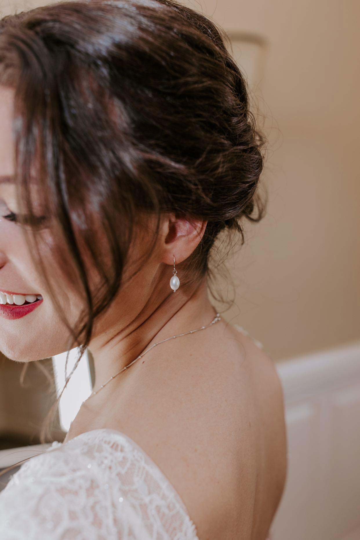 pearl drop earrings on bride designed by Carrie Whelan
